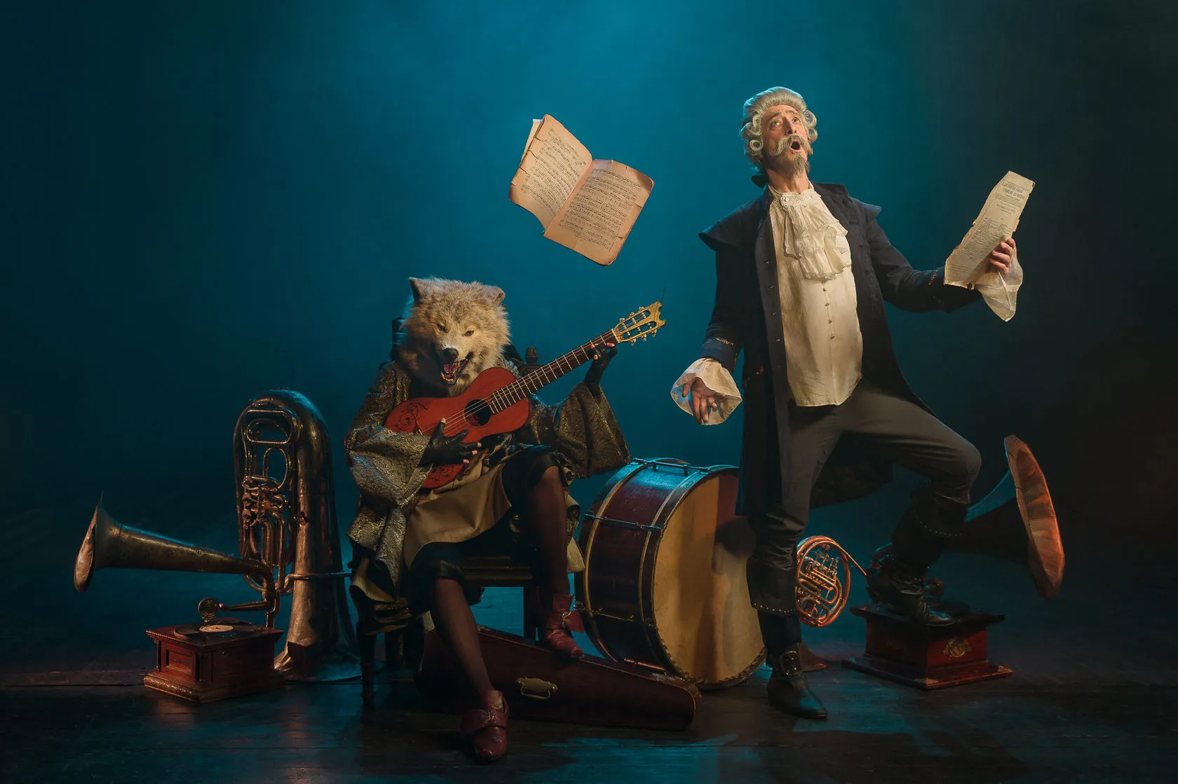 The Baron sings as sheet music flies, beside a wolf-headed guitarist among drums and brass.