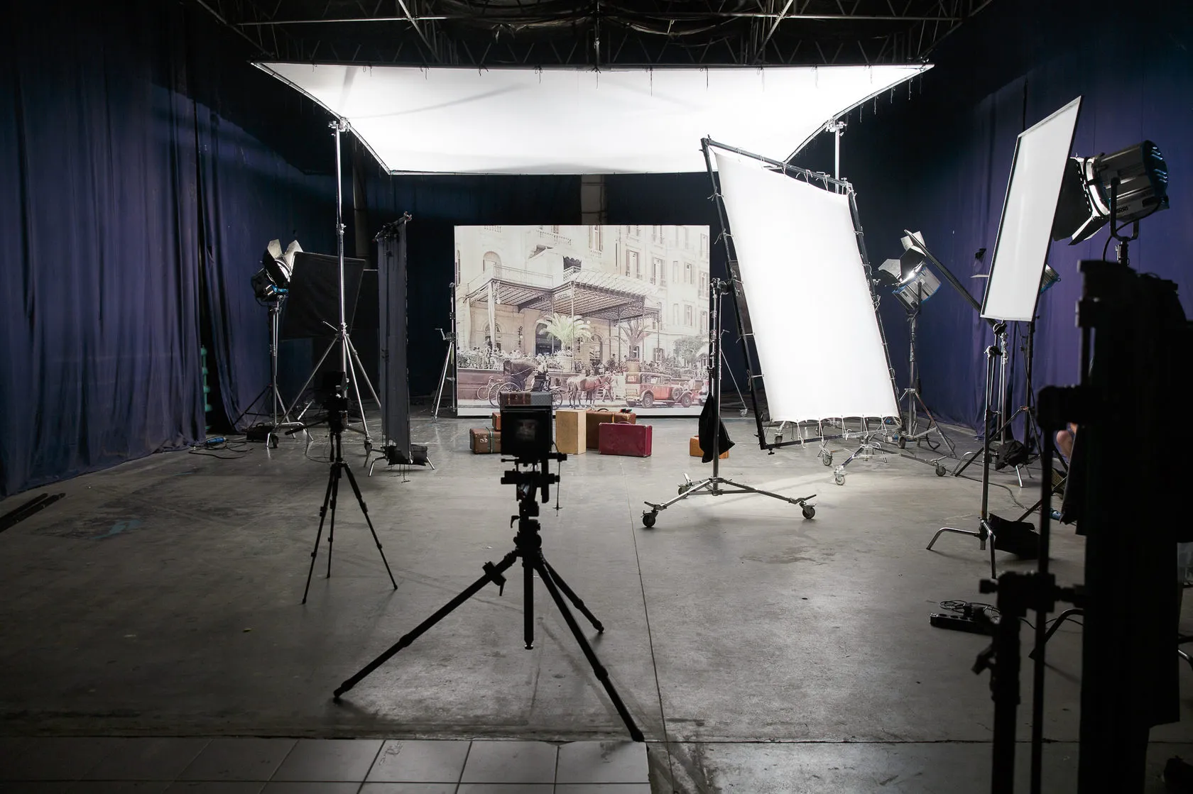 Travel As Art by Andrei Kovalev: a studio set shows a hotel backdrop lit for a double-exposure cover shoot.