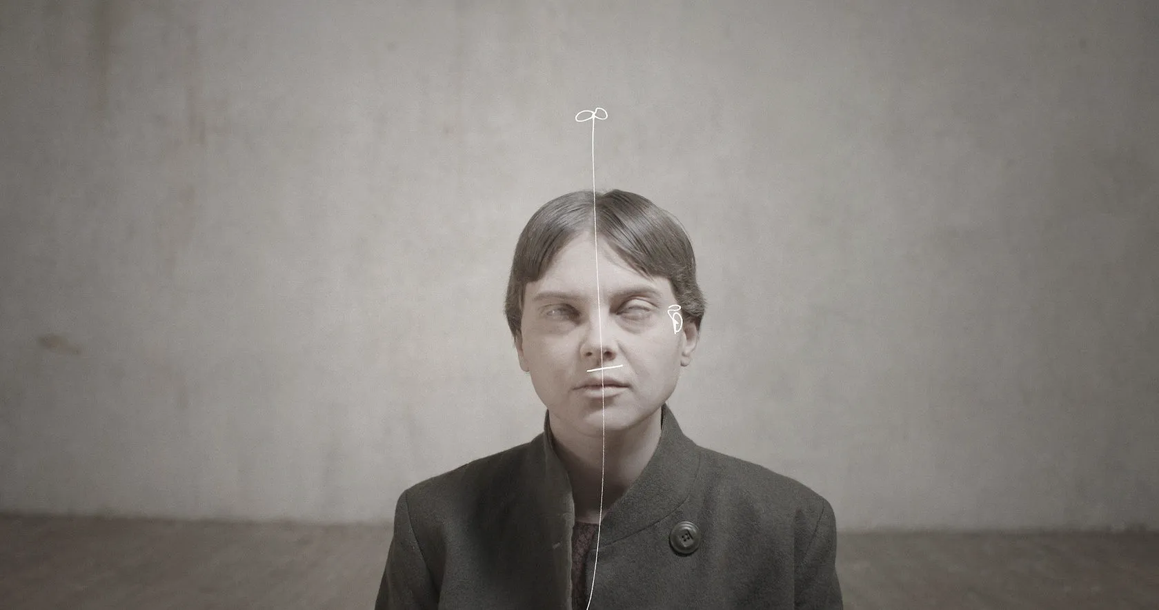 A pale woman with blank, clouded eyes, a white line drawn down her face.